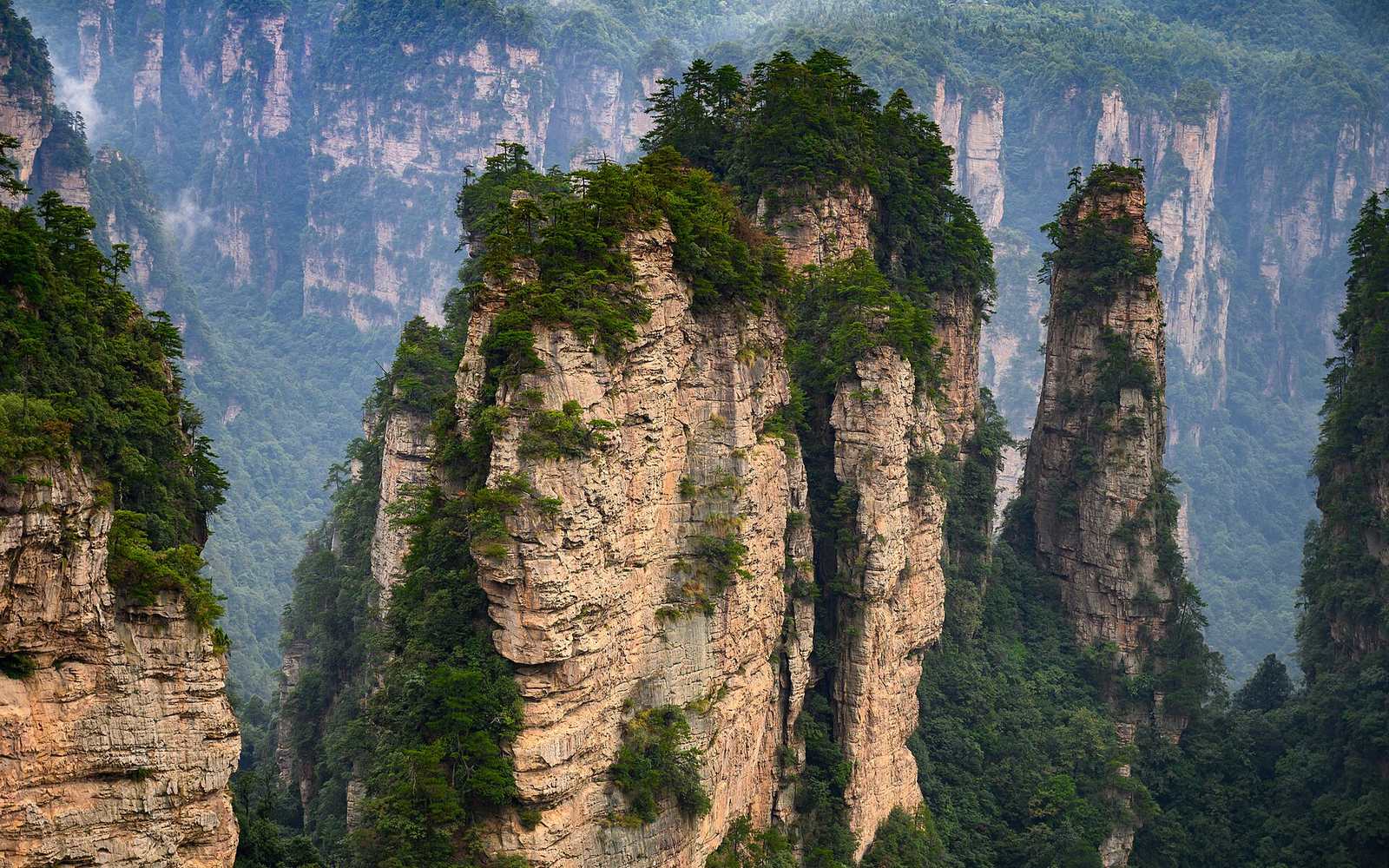 Sandstone pillars in Zhangjiajie National Forest Park, the pinnacles behind the floating mountains in Avatar
